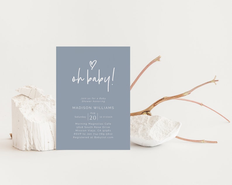 May include: A light blue baby shower invitation with white text that reads "oh baby!" and includes details for a baby shower honoring Madison Williams on August 20th at 12 o'clock at Morning Magnolias Cafe. The invitation also includes the address and RSVP information.