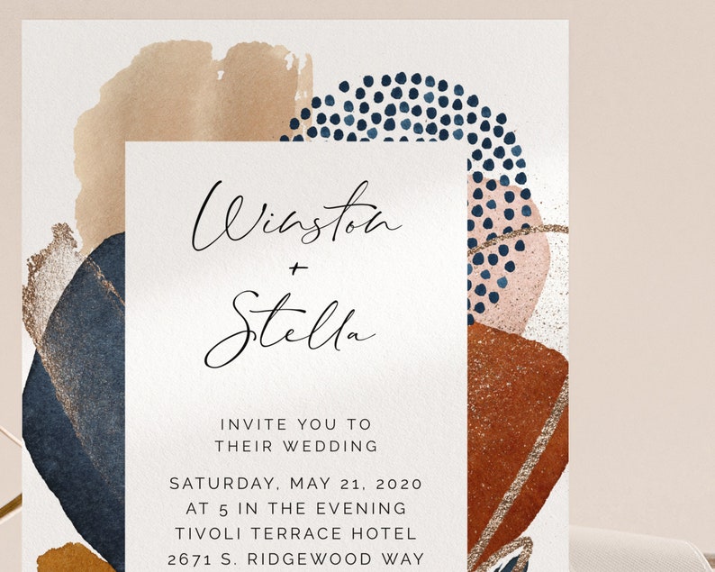 May include: Wedding invitation with abstract watercolor shapes in shades of blue, brown, and pink. The text reads "Winston + Stella" and includes the date, time, and location of the wedding.
