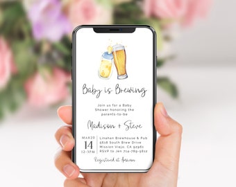 May include: A digital invitation for a baby shower with a watercolor illustration of a baby bottle and a beer glass clinking. The text reads "Baby is Brewing" and includes the date, time, location, and RSVP information.