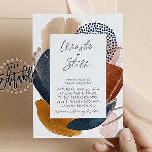 May include: Wedding invitation with abstract watercolor shapes in shades of blue, brown, pink, and gold. The text reads "Winston + Stella" and includes the date, time, and location of the wedding.
