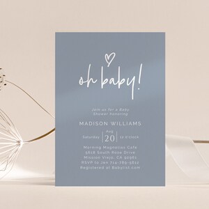 May include: A blue baby shower invitation with white text that reads "oh baby!" and includes details for the event, including the honoree's name, date, time, location, and RSVP information.