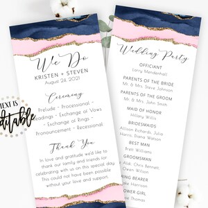 May include: Elegant wedding program featuring a navy blue, pink, and gold watercolor design. The program includes the names of the couple, ceremony details, and wedding party information. The text is editable.