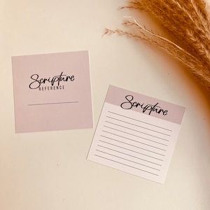 May include: Two light pink note cards with the word "Scripture" written in black cursive. One card has a blank line for a reference and the other has lined paper for writing.
