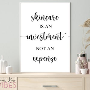 May include: A white framed print with black text that reads "Skincare is an investment not an expense".