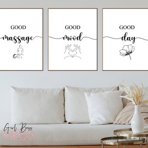 May include: Three black and white minimalist prints with the text "Good massage", "Good mood", and "Good day" with simple line drawings of a person getting a massage, hands making a heart shape, and a flower.