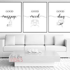 May include: Three black and white minimalist prints with the text "Good massage", "Good mood", and "Good day" with simple line drawings of a person getting a massage, hands making a heart shape, and a flower.