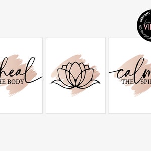May include: Three printable wall art prints with a minimalist design. The prints feature a pink watercolour background with black text and a lotus flower illustration. The text reads "heal the body", "calm the spirit", and a lotus flower.
