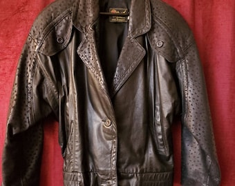 Vintage Reed Sportswear satin lined batwing 80s vintage black leather textured motorcycle jacket with shoulder pads; punk new wave fashion