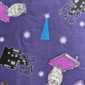 May include: Purple fabric with a repeating pattern of owls, books, stars, and a blue triangle. The owls are white with glasses, and the books have purple covers. The stars are white, and the triangle is blue.