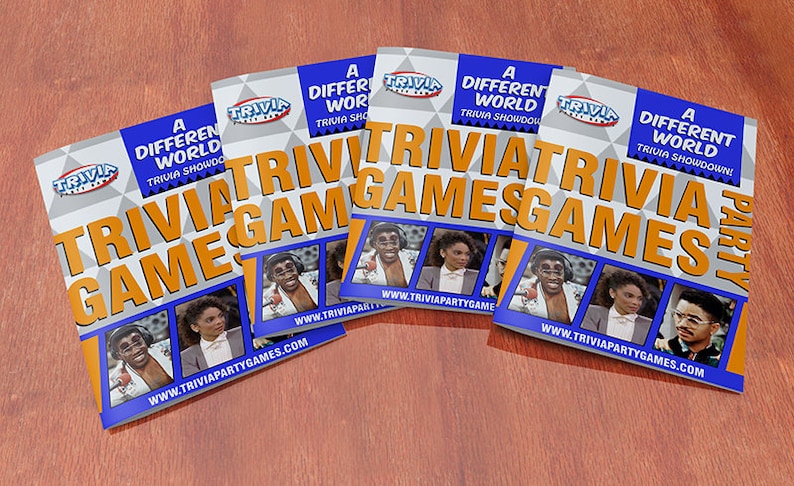 May include: Four blue and orange game cards with the text "A Different World Trivia Showdown!" and "Trivia Games" on them. The cards feature photos of the cast of the television show "A Different World".