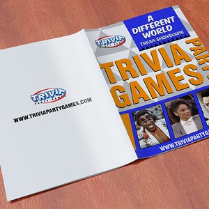 May include: A blue and orange booklet with the text "A Different World Trivia Showdown! Trivia Games Party" and images of three people. The website www.triviapartygames.com is printed on the front and back covers.