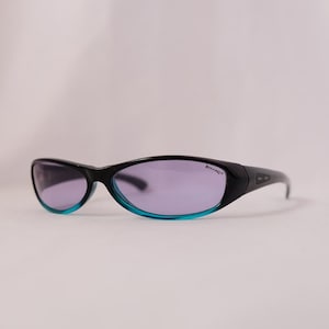 Authentic Rolling Vintage 90s Made Small Overall Frame Blue Sunglasses for both Womens and Mens