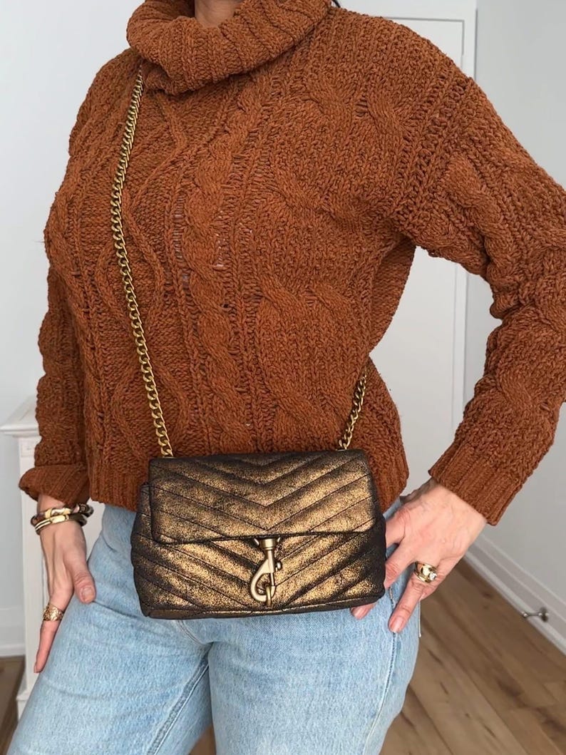 May include: A set of three ceramic mugs with a speckled, matte finish. The mugs are in shades of cream, light gray, and dark gray. Each mug has a simple, minimalist design, perfect for coffee or tea.