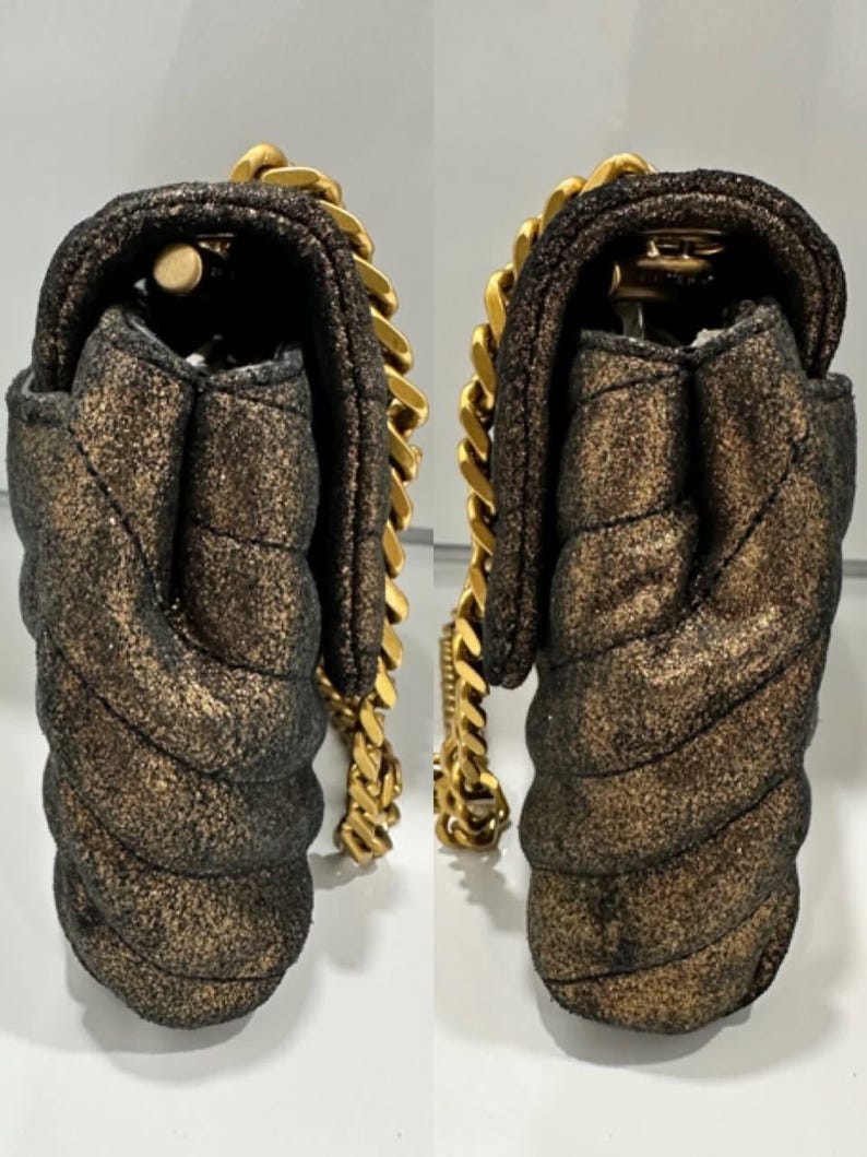 May include: A white ceramic mug with a black handle and the text "But First, Coffee" in a black, handwritten-style font. The mug is on a white surface.