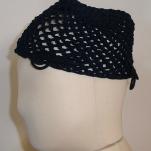 May include: A navy blue crocheted hat with a wide brim and a loose, open weave. The hat has a simple design and is made of a soft, comfortable material.
