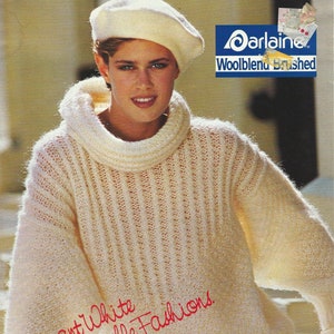 May include: A white knitted sweater with a turtleneck and a cable knit pattern. The sweater is made of a soft, brushed wool blend. The text "Carlaine Woolblend Brushed" is visible in the upper right corner of the image. The text "Elegant White for Irresistible Fashions" is written in red cursive on the sweater. The text "4 Exciting Patterns You Can Knit" is visible in the lower right corner of the image.