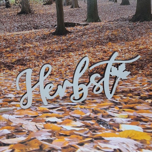 Schriftzug Herbst mit Ahornblatt aus Holz in weiß optional mit Aufsteller