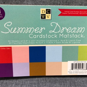 May include: A pack of 81 sheets of 6.5" x 4.5" cardstock in a variety of colors, including red, pink, blue, brown, and green. The cardstock is acid and lignin free and is labeled "Summer Dream Cardstock Matstack".
