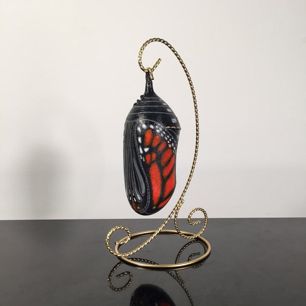 5 3/4" Ready to Emerge Monarch Chrysalis with Stand , 8 1/2"in stand, Chrysalis hand crafted of Wood and Polymer Clay, Painted with Acrylics