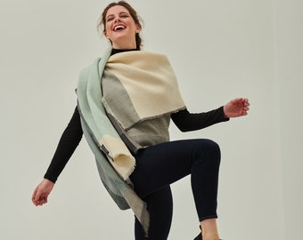 Daria Cape Volga. Multifunctional wool poncho that can be worn as a dress, wrap, vest, hoodie. Ideal for layering, travel, work, maternity