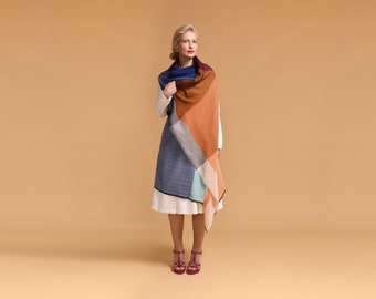 Daria Cape Ganges. Multifunctional wool poncho that can be worn as a dress, wrap, vest, hoodie. Ideal for layering, travel, work, maternity