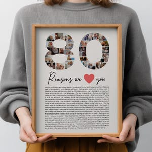 May include: A framed collage print featuring the number 80 composed of small circular photographs. Below the number, the text reads Reasons we love you with a red heart icon, followed by a long list of printed reasons in black text.