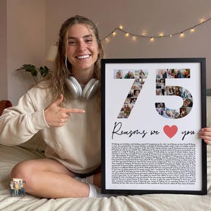 May include: A framed rectangular poster featuring a large number 75 composed of multiple small square photographs. Below the number, the text reads Reasons we love you, followed by a red heart and a long list of printed reasons in black text.
