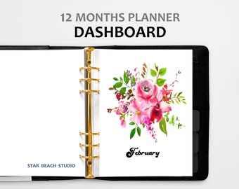 May include: A white planner with a gold binder ring and a floral design on the page. The page has the word "February" written on it. The planner is labeled "12 Months Planner Dashboard" and "Star Beach Studio".