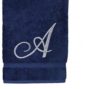 May include: A navy blue hand towel with a silver embroidered letter A.