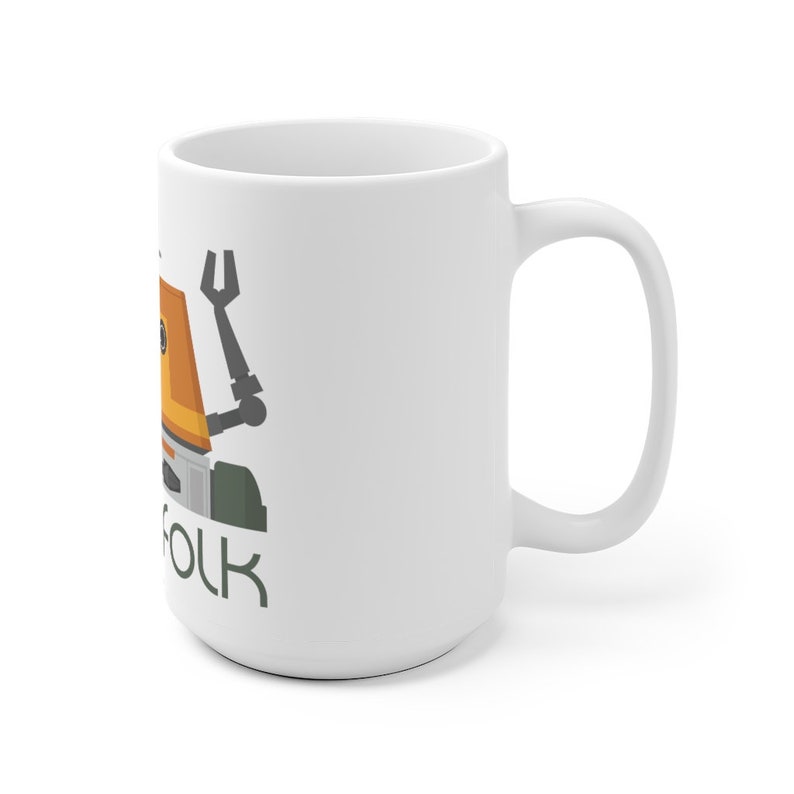 May include: White ceramic mug featuring a cartoon illustration of a robot with an orange body, grey legs, and a black arm with a wrench. The text "Folk" is printed below the robot.