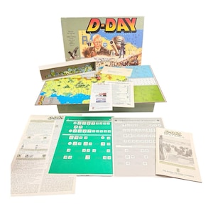 May include: A D-Day board game set including a large illustrated box, a hexagonal map board, a white tray filled with small game counters, several printed instruction manuals, and order of appearance sheets with text and military unit symbols.
