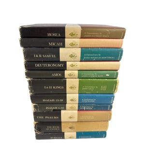 May include: A vertical stack of eleven hardcover books with black spines on the left and colorful panels on the right. Each spine features white text identifying the biblical book, a small gold emblem, and the author's name in white text.