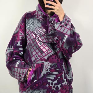 May include: A set of three ceramic mugs with a speckled, matte finish. The mugs are in shades of cream, light gray, and dark gray. Each mug has a simple, minimalist design, perfect for coffee or tea.