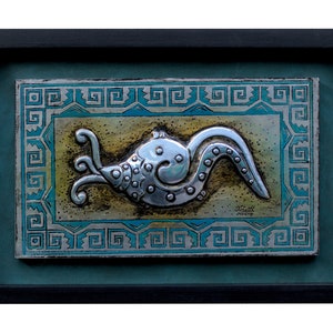 Aztec snail. Embossed in aluminum. Metal embossing. Aztec art. Aztec culture. Pre-Hispanic Mexico