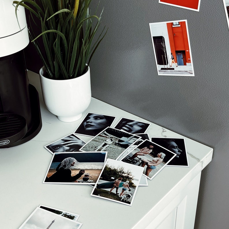 A creative display of personalized fridge magnets, each showing a different memorable moment or event.