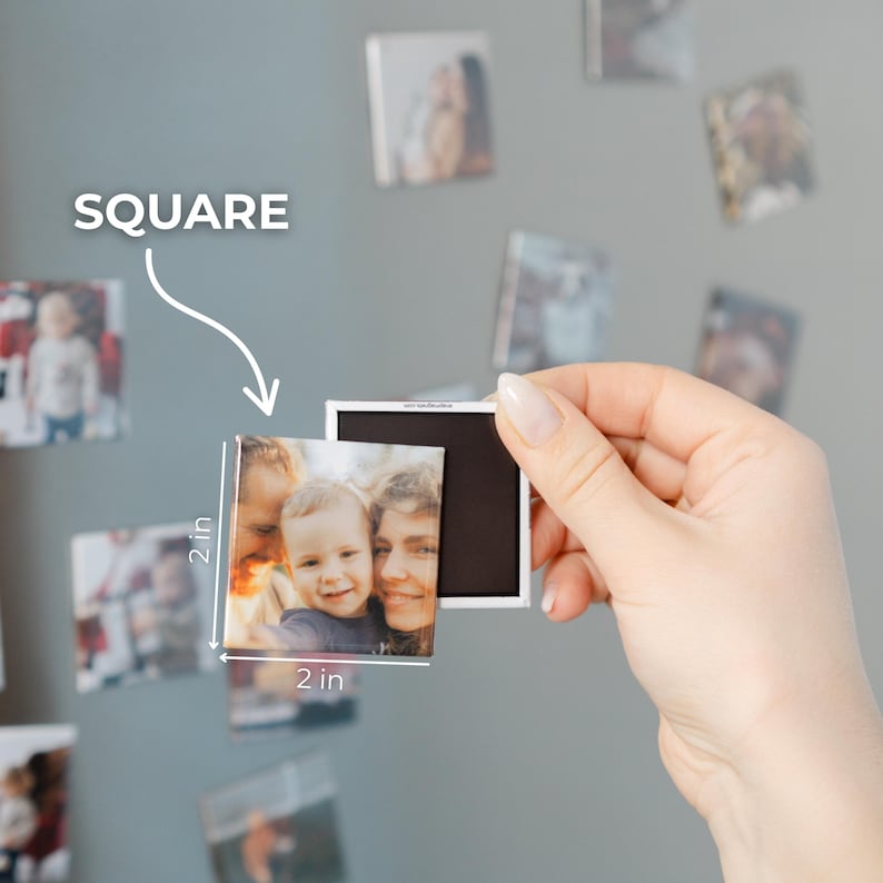 A hand holding a small square magnet with a photo of a family on it, with the word "SQUARE" written above the magnet.
