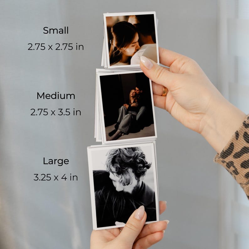 A person's hand holding three different sizes of photo cards, with the largest card being 3.25 x 4 inches and the smallest being 2.75 x 2.75 inches.