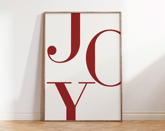 May include: A framed print with the word "JOY" in bold, red letters on a white background.