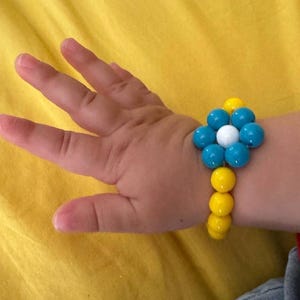 Handmade Dora the Explorer bracelet in elastic cord