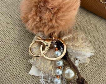 Bag keychain with a natural orchid, handmade in UV resin.