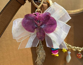 Handbag Accessory with Natural Orchid handmade in UV resin.