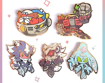 May include: A collection of five enamel pins depicting characters from a video game. The pins feature a red and yellow character, a robot, a purple and white character, a tan and black character, and a blue character.
