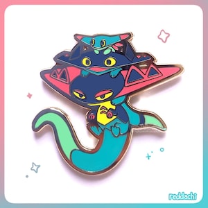 May include: A colorful enamel pin featuring a stylized creature with a blue body, yellow accents, and a red and blue hat. The pin has a gold border and a long, teal tail. The pin is set against a white background with a pink and blue gradient.