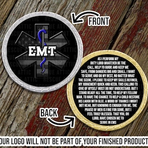 May include: Two silver and gold round challenge coins with a black and white star of life symbol and the text "EMT" on one side and a quote about the duties of an EMT on the other side.