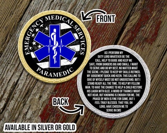 May include: A gold and silver challenge coin with the words "Emergency Medical Services Paramedic" on the front. The back of the coin has a quote about the duties of a paramedic.