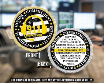 May include: A round challenge coin featuring a gold-rimmed design. The front displays a yellow headset icon, the text 911 DISPATCHER, and the words HONOR, COMMITMENT, INTEGRITY, PROFESSIONAL. The back features text about the thin gold line.