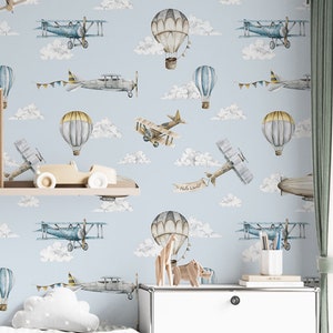 Carta da parati con aereo vintage in cielo azzurro e nuvole per la cameretta dei ragazzi