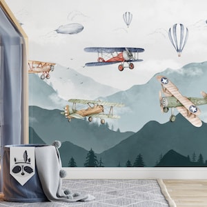 Wallpaper for a boy&#39;s room Vintage Airplanes, Balloons and an Airship among the mountains and clouds