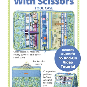 May include: A green and blue fabric tool case with the words "Running With Scissors" and "Tool Case" printed on the front. The case has multiple pockets and compartments for carrying scissors, markers, rotary cutters, and other small tools. It also includes a coupon for a $5 add-on video tutorial.