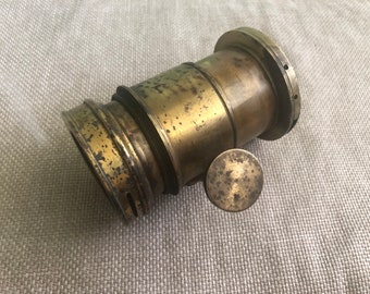 Large antique lens in a brass case, Petzval lens